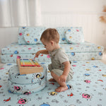 Toddler playing with Baby Shark™ x Roo & You™ Stepping Stones, soft foam balance toys for kids.