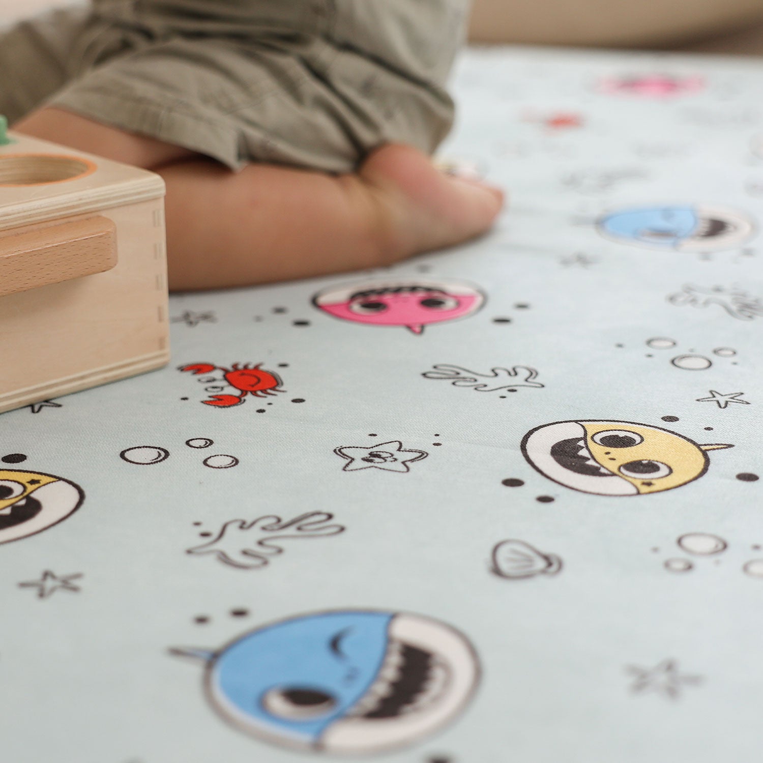 Close-up of the Baby Shark™ x Roo & You™ Play Mat showing character details.
