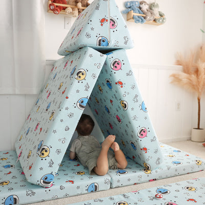 Toddler playing with Baby Shark™ x Roo & You™ Joey Play Couch covered in character print.