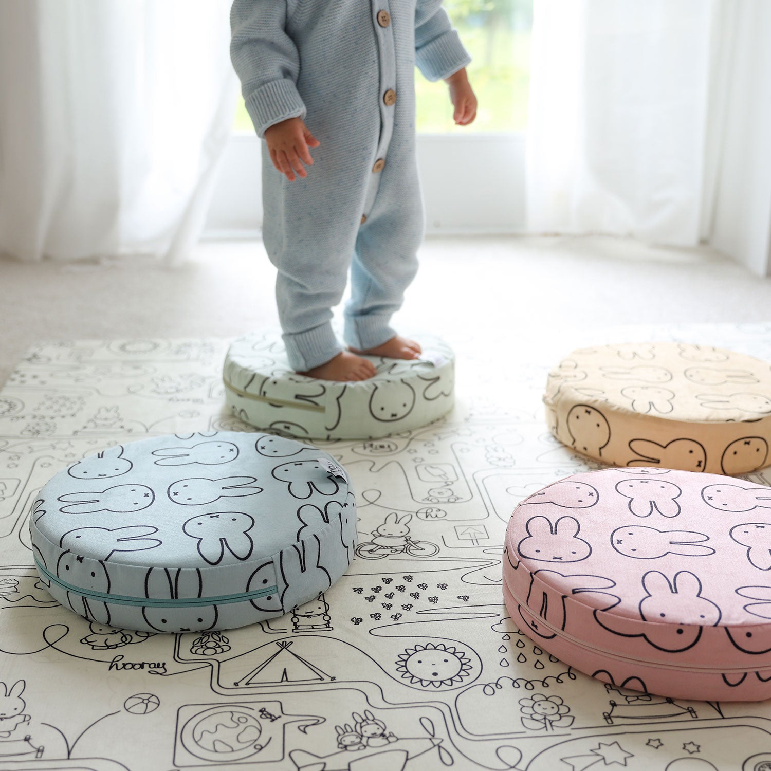 Child playing on colorful Miffy Stepping Stones with bunny print