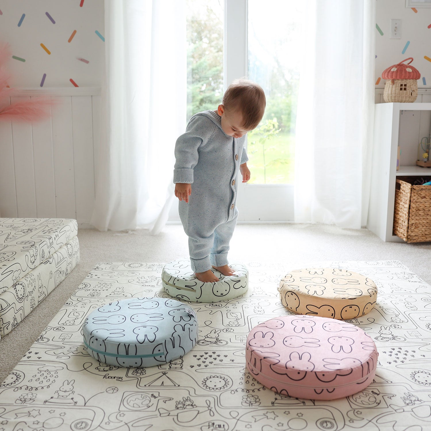 Child stepping on colorful Miffy Stepping Stones with bunny print